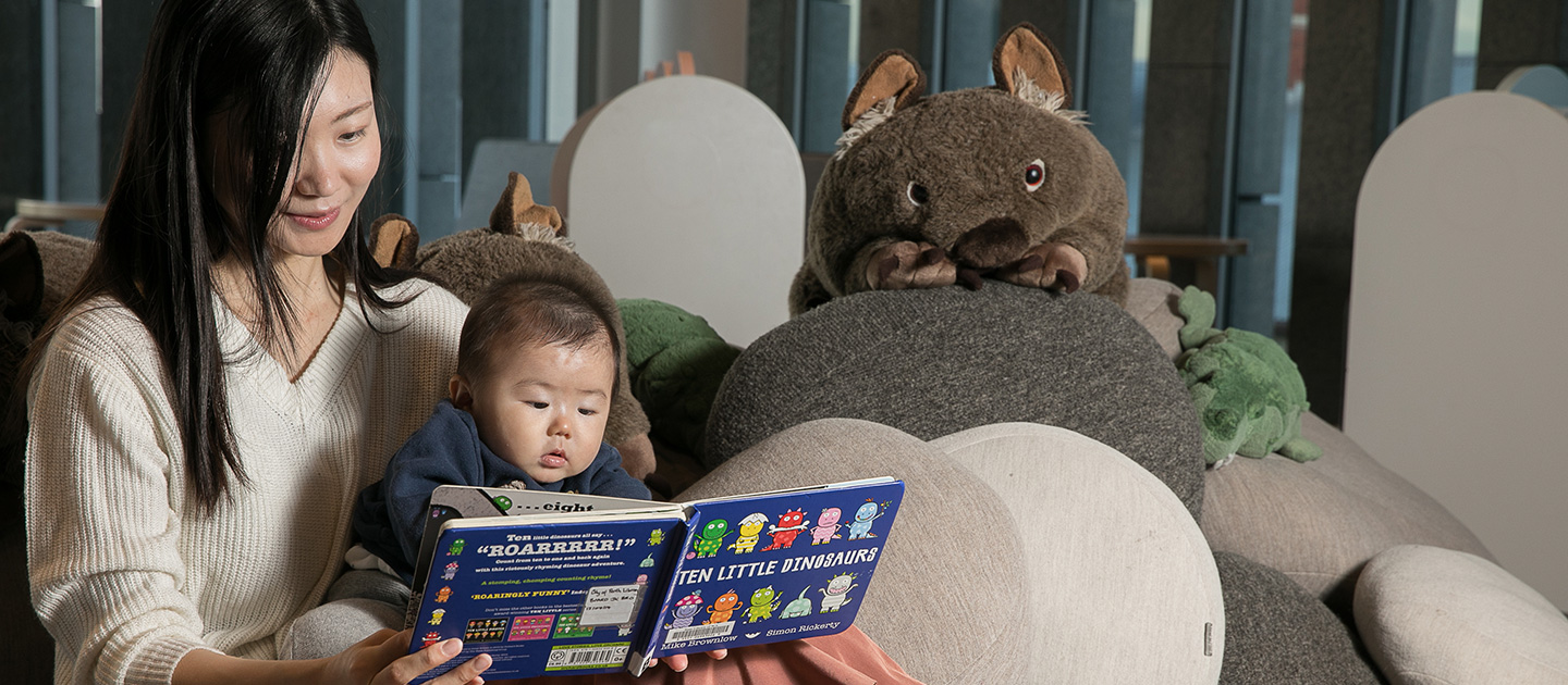 Mother reading to baby