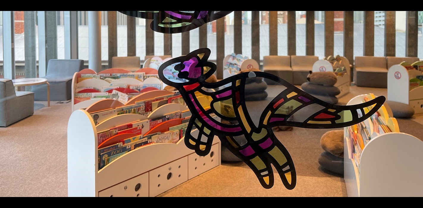 Stained glass kangaroo design on the interior glass wall of Level 4 at the Library