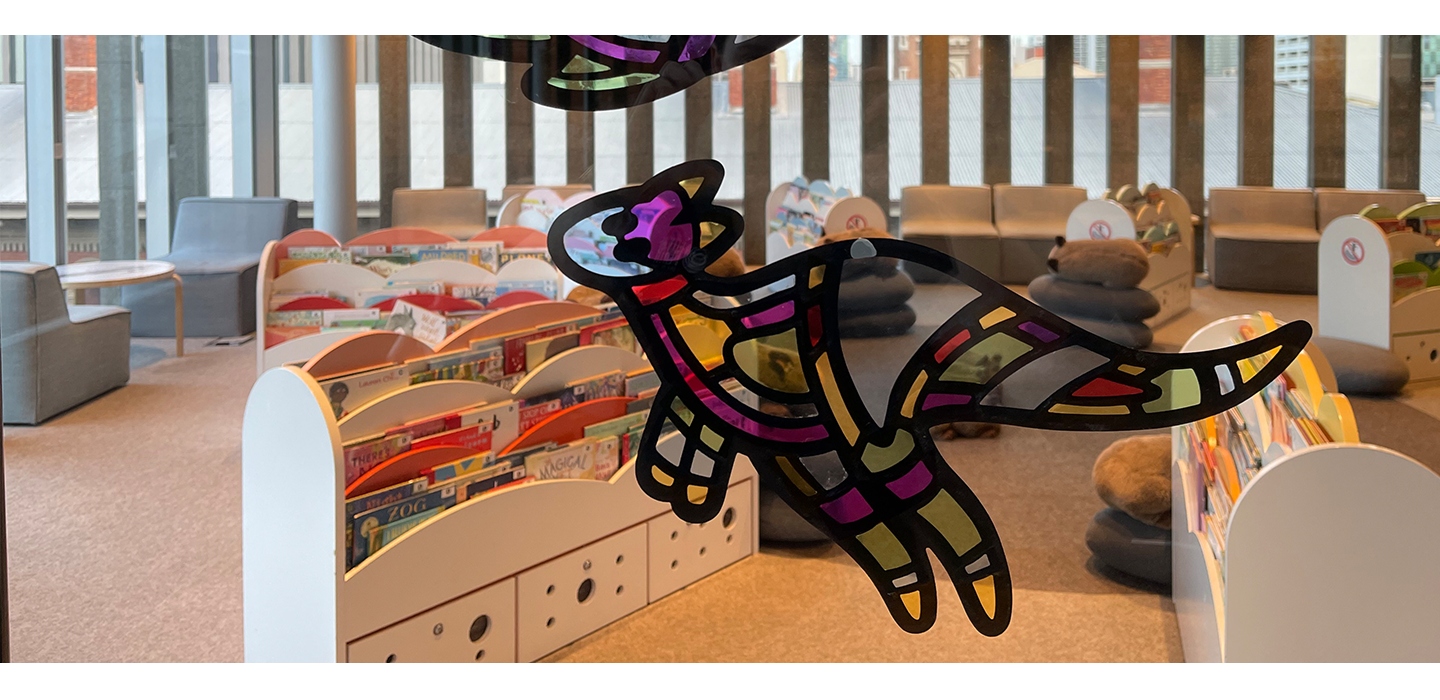 Stained glass kangaroo design on the interior glass wall of Level 4 at the Library