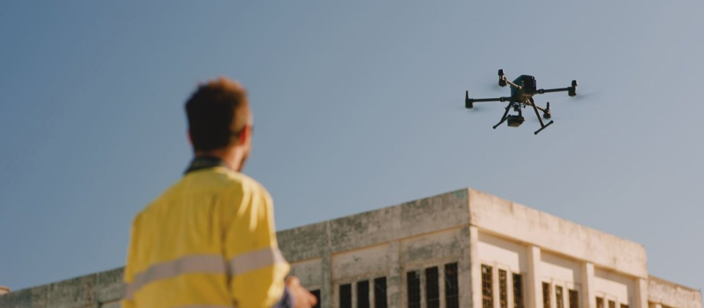 Drone operator and drone outside East Perth Power Station.