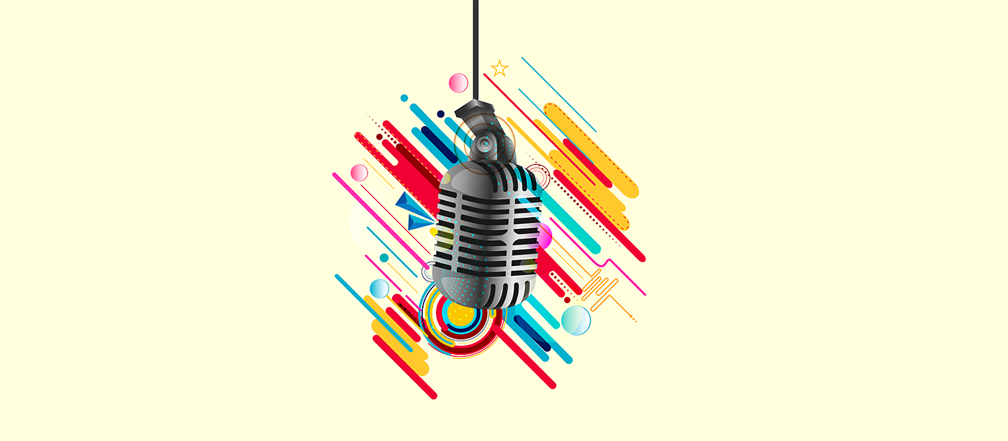 Old fashioned grey microphone against a yellow and colourful shapes background