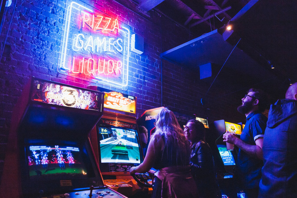 Game screens and neon signs