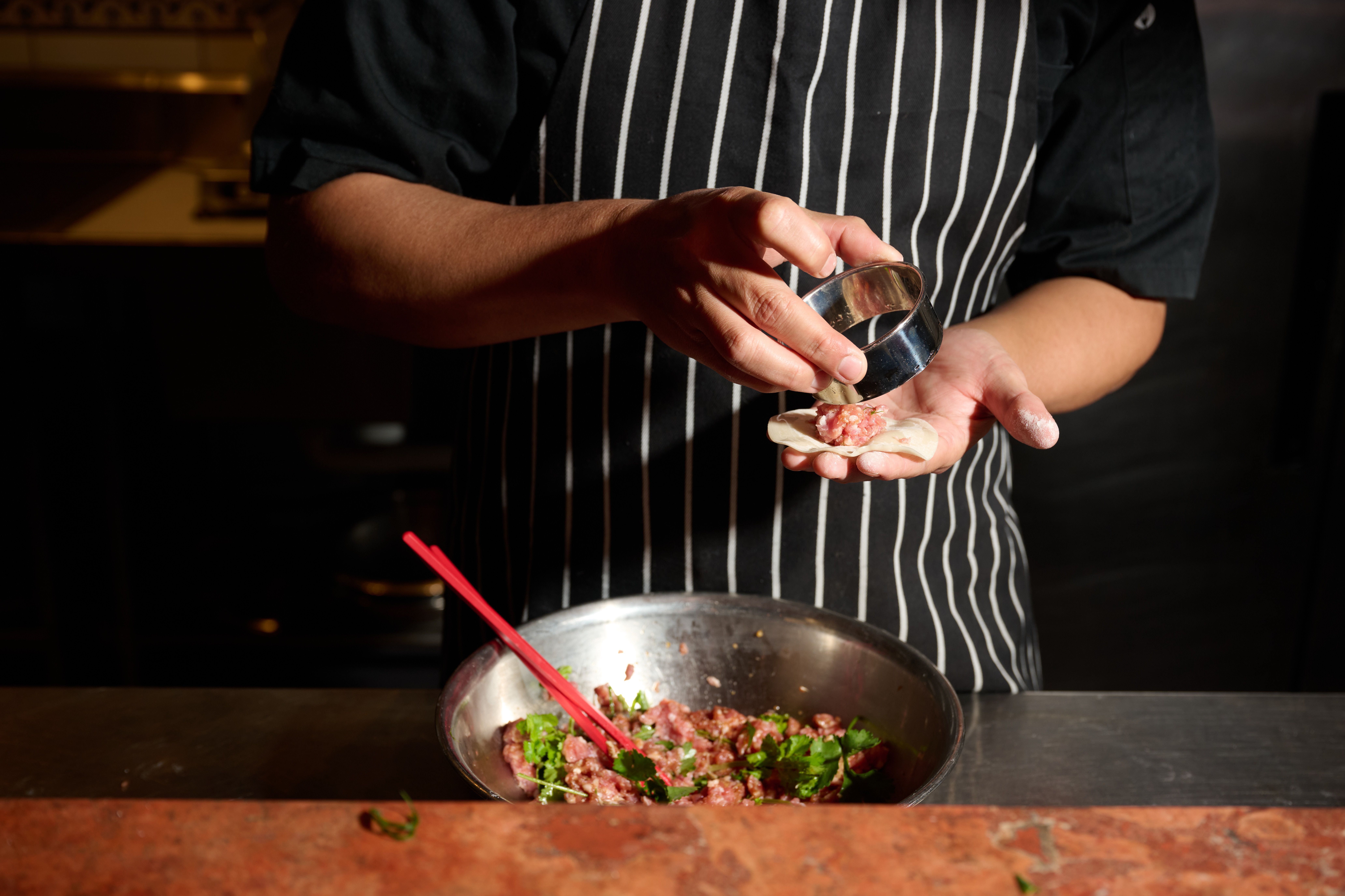 chef making dumplings