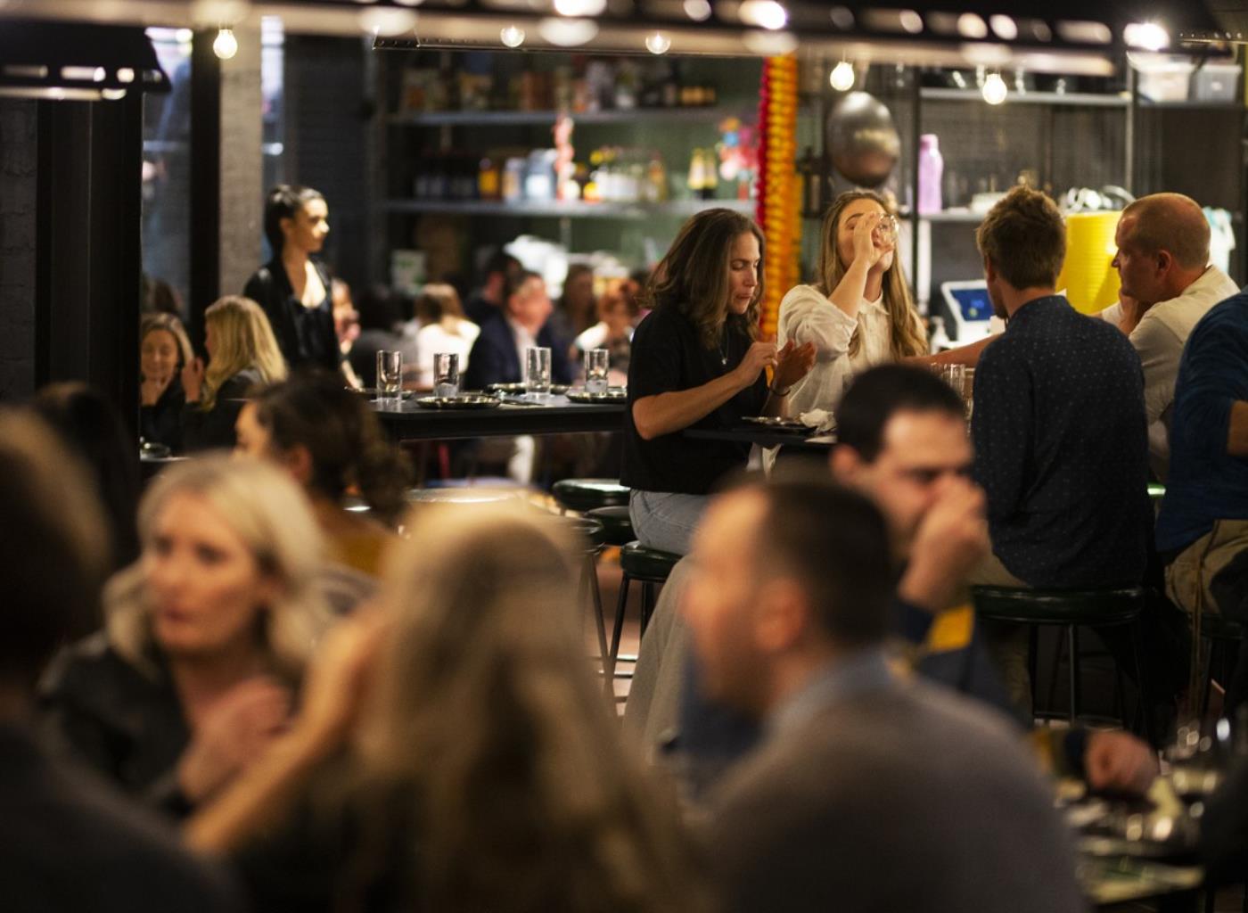 people having drinks at a bar