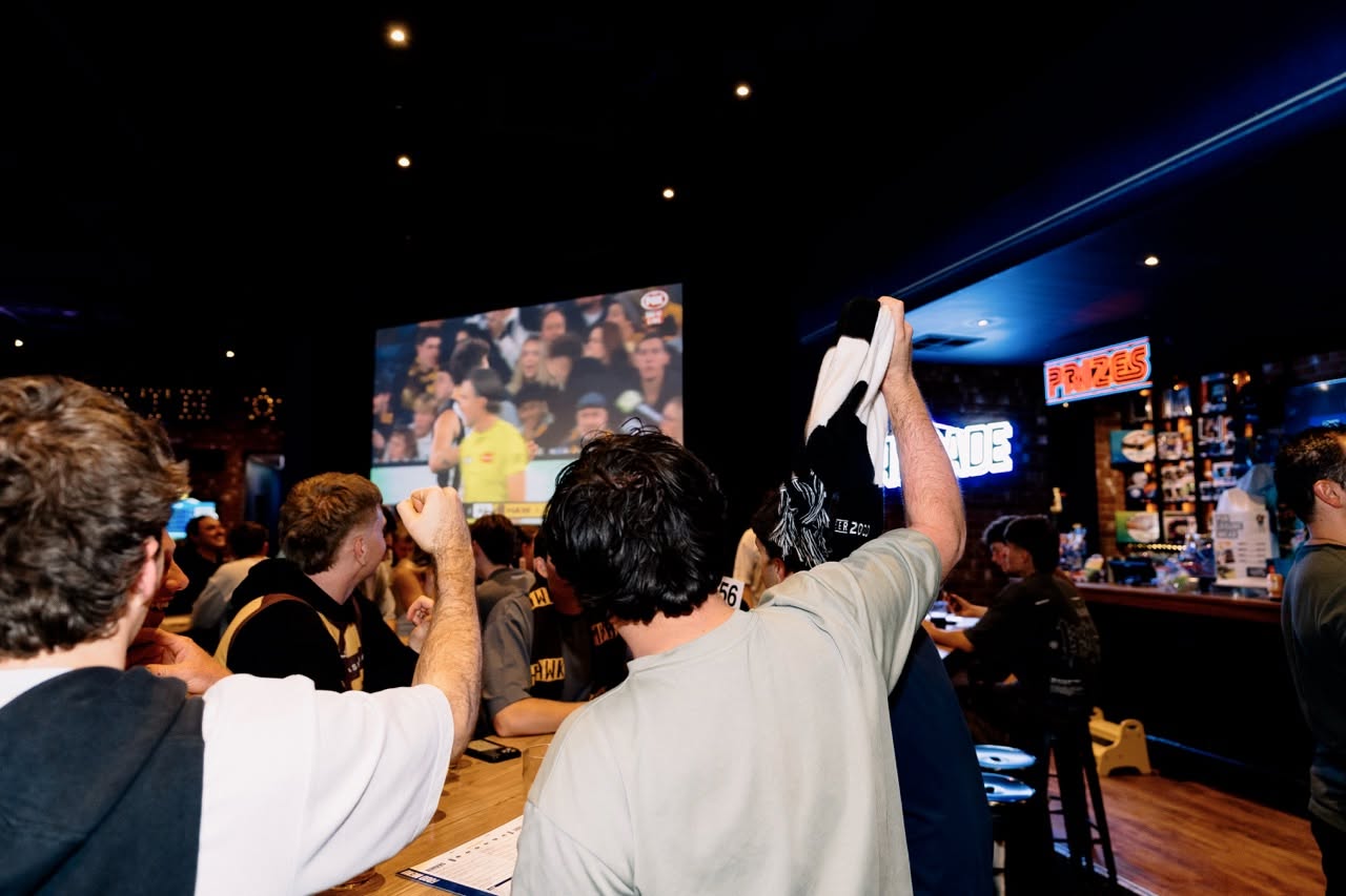 Fans watching AFL at pub