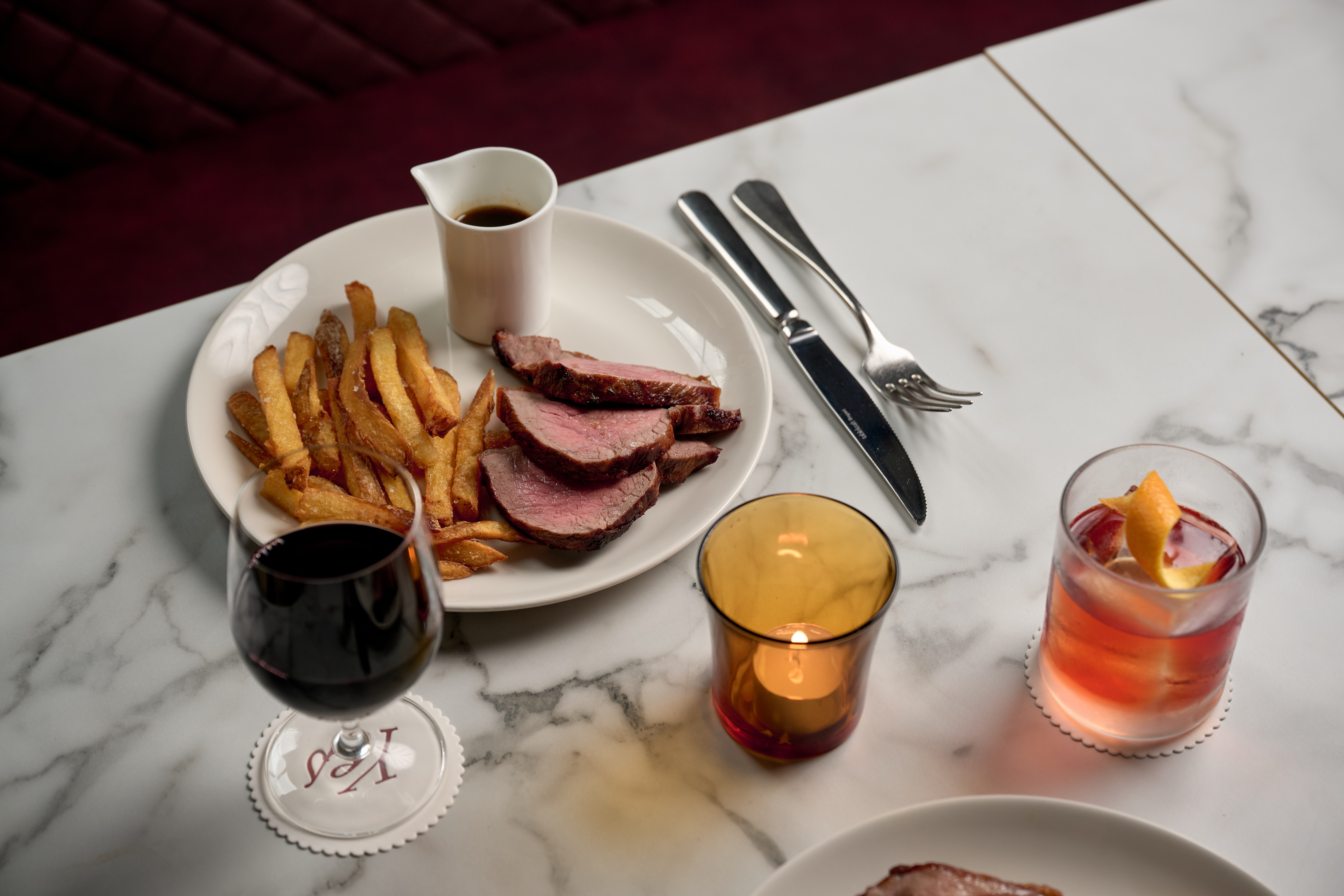 steak frites with wine and cocktail