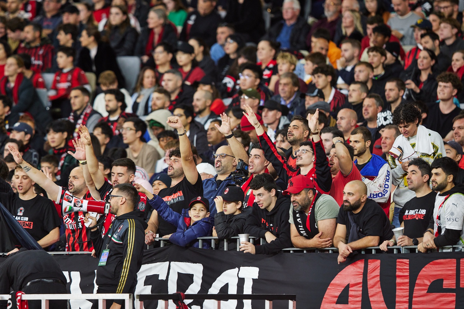 Fans cheering at a football match