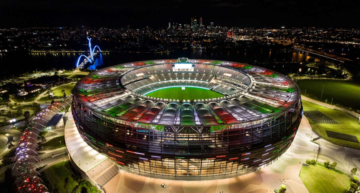Optus Stadium lit in the colours of the Italian flag