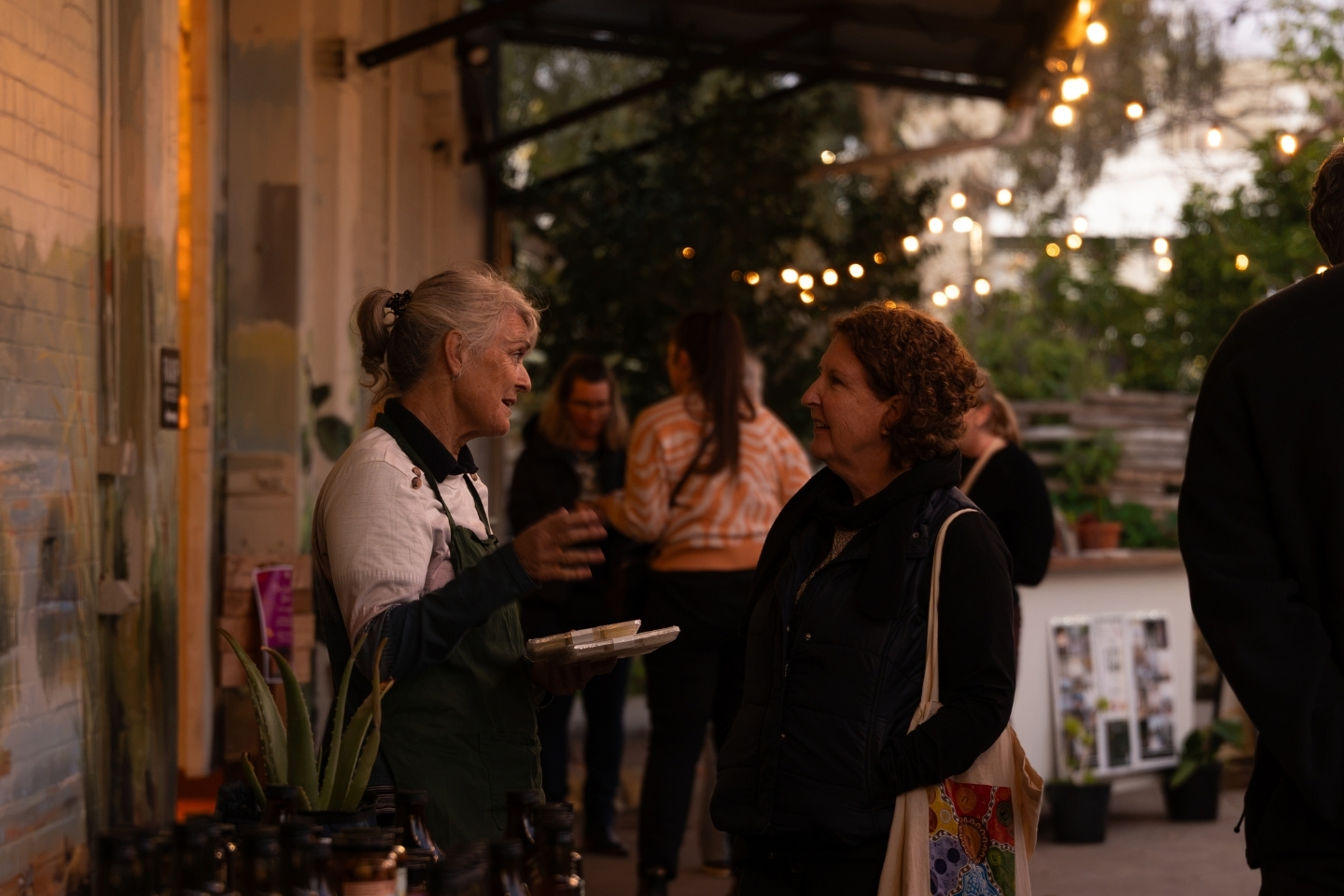 People enjoying an event at City Farm